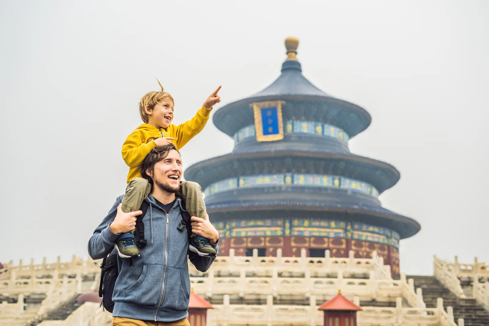 A father and child visiting the Temple of Heaven in Beijing
